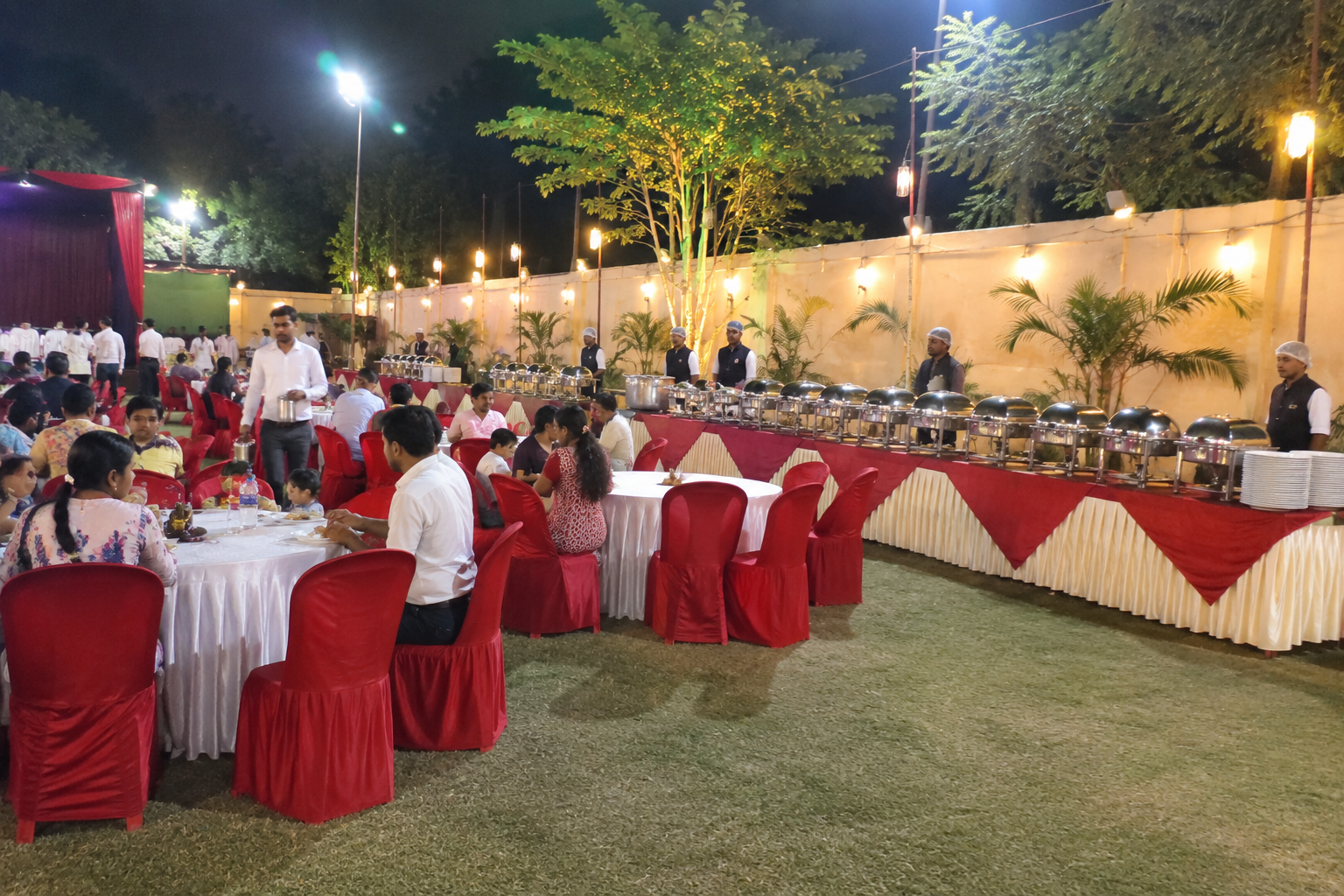 Outdoor event setup with buffet counter at the rear